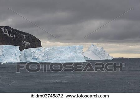 Stock Image - "An iceberg floating in the South Atlantic, Brown Bluff, Antarctic Peninsula, Antarctica". Fotosearch