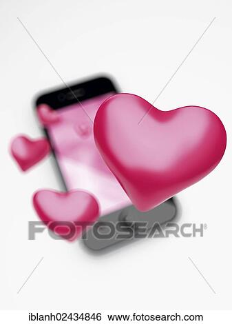 Stock Photograph - An IPhone with hearts. Fotosearch