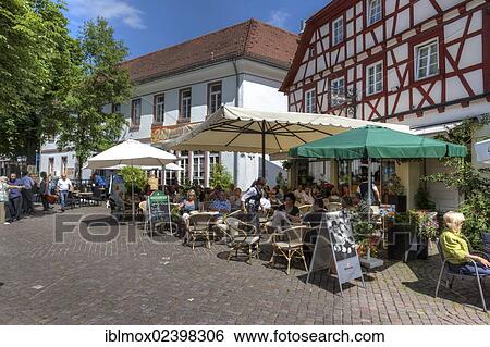 Stock Photograph - "An old half-timbered house with a garden restaurant in the historic district of Mosbach, Odenwald, Rhein-Neckar-Kreis, Baden-Wuerttemberg, Germany, Europe, PublicGround, Europe". Fotosearch