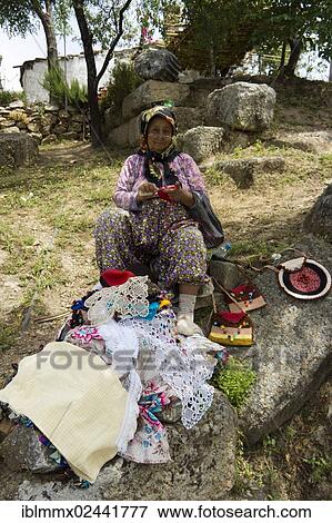 "An old woman with reading glasses is selling lace to tourists, Bafa Golu, Lake Bafa, or Camici Golu, lake, west coast of Turkey, Kapikiri, Mus, Turkey, Asia" View Large Photo Image Stock Photo - "An old woman with reading glasses is selling lace to tourists, Bafa Golu, Lake Bafa, or Camici Golu, lake, west coast of Turkey, Kapikiri, Mus, Turkey, Asia". Fotosearch