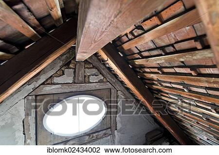 "An oval window, wooden beams, attic, wooden roof of an old building, Stuttgart, Baden-Wuerttemberg, Germany, Europe" View Large Photo Image Stock Image - "An oval window, wooden beams, attic, wooden roof of an old building, Stuttgart, Baden-Wuerttemberg, Germany, Europe". Fotosearch