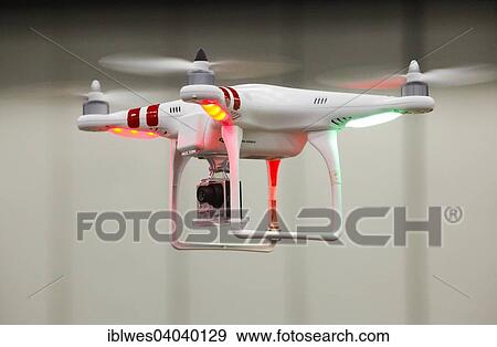 "An unmanned aerial vehicle or drone, equipped with a camera, on display at the Intelligent Transport Systems World Congress, Detroit, Michigan, United States, North America" View Large Photo Image Stock Photo - "An unmanned aerial vehicle or drone, equipped with a camera, on display at the Intelligent Transport Systems World Congress, Detroit, Michigan, United States, North America". Fotosearch