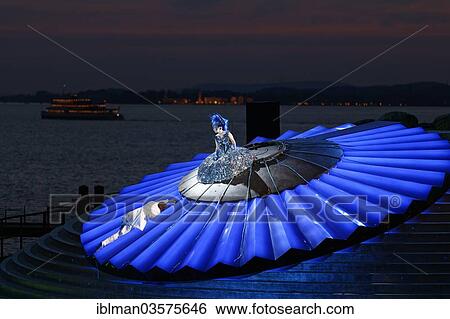 Stock Photograph - "Ana Durlovski as Queen of the Night and Rainer Trost as Tamino in The Magic Flute by Wolfgang Amadeus Mozart, opera performance on the floating stage on Lake Constance, Bregenz Festival 2013, Bregenz, Vorarlberg, Austria, Europe". Fotosearch