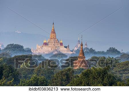 "Ananda Temple in the morning fog, blue hour, gilded tower structure or Shikhara, stupas, pagodas, temple complex, Plateau of Bagan, Mandalay Division, Burma or Myanmar" View Large Photo Image Stock Image - "Ananda Temple in the morning fog, blue hour, gilded tower structure or Shikhara, stupas, pagodas, temple complex, Plateau of Bagan, Mandalay Division, Burma or Myanmar". Fotosearch