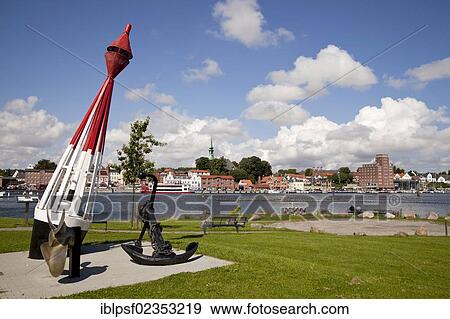 Stock Photo - "Anchor, buoy and propeller in front of the cityscape of Kappeln in Schleswig-Holstein, Germany, Europe". Fotosearch