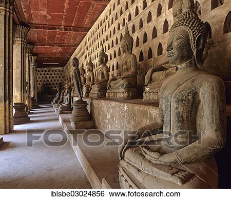"Ancient Buddha statues lining the walkway in the courtyard of Wat Si Saket Temple, Vientiane, Vientiane Province, Laos, Asia" View Large Photo Image Stock Photograph - "Ancient Buddha statues lining the walkway in the courtyard of Wat Si Saket Temple, Vientiane, Vientiane Province, Laos, Asia". Fotosearch