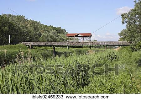 "Andau bridge, escape route across the Einser Canal after the Hungarian uprising, reconstruction, the original was demolished in 1956, Illmitz, Burgenland, Austria, Europe" View Large Photo Image Stock Image - "Andau bridge, escape route across the Einser Canal after the Hungarian uprising, reconstruction, the original was demolished in 1956, Illmitz, Burgenland, Austria, Europe". Fotosearch