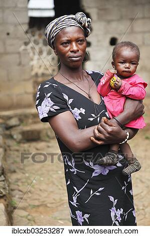 Stock Photo - "Anesta, 32, one of the wives of King Yu Vincent, with her daughter, Palace of Laikom, Laikom, Northwest Region, Cameroon, Africa". Fotosearch