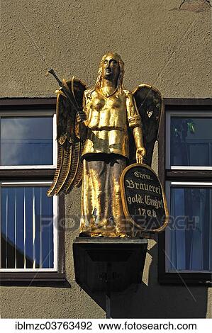 "Angel figure from 1861 at the former brewery and guesthouse """"Goldener Engel"""", German for Golden Angel, Dinkelsbuhl, Middle Franconia, Bavaria, Germany, Europe" View Large Photo Image Stock Image - "Angel figure from 1861 at the former brewery and guesthouse """"Goldener Engel"""", German for Golden Angel, Dinkelsbuhl, Middle Franconia, Bavaria, Germany, Europe". Fotosearch