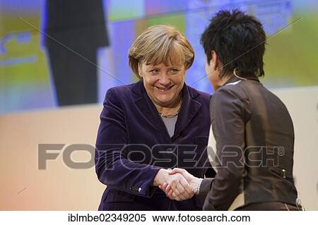 "Angela Merkel, the German Federal Chancellor, shaking hands with TV presenter Dunja Hayali during the Goldene Sterne des Sports 2011 award ceremony, Berlin, Germany, Europe" View Large Photo Image Stock Photography - "Angela Merkel, the German Federal Chancellor, shaking hands with TV presenter Dunja Hayali during the Goldene Sterne des Sports 2011 award ceremony, Berlin, Germany, Europe". Fotosearch