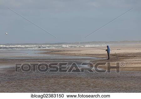 "Angler on the beach near Henne Molle A, West Jutland, Denmark, Europe" View Large Photo Image Stock Image - "Angler on the beach near Henne Molle A, West Jutland, Denmark, Europe". Fotosearch