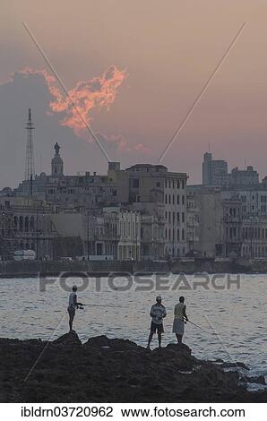 Stock Image - "Anglers on the Malecon, Havana's seaside promenade, Havana, La Habanna, Cuba, North America". Fotosearch