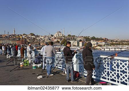 "Anglers standing on the Galata Bridge, Galata Bridge, Golden Horn, Sueleymaniye Mosque at the back, Istanbul, european side, Turkey, Europe, PublicGround, Asia" View Large Photo Image Stock Photo - "Anglers standing on the Galata Bridge, Galata Bridge, Golden Horn, Sueleymaniye Mosque at the back, Istanbul, european side, Turkey, Europe, PublicGround, Asia". Fotosearch