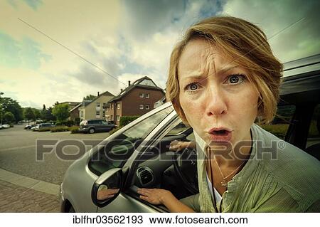 "Angry woman car driver sticking out her head out of the window, Grevenbroich, Rhineland, North Rhine-Westphalia, Germany, Europe" View Large Photo Image Stock Image - "Angry woman car driver sticking out her head out of the window, Grevenbroich, Rhineland, North Rhine-Westphalia, Germany, Europe". Fotosearch