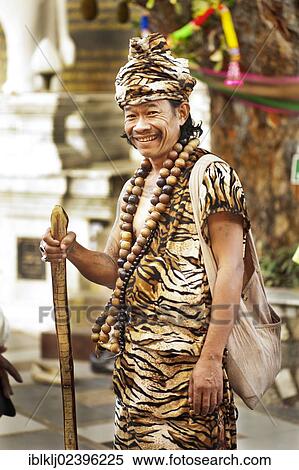 "Animist hermit says healing prayers and tells fortunes at Doi Suthp Buddhist temple in Chiang Mai, Thailand, Asia" View Large Photo Image Stock Photography - "Animist hermit says healing prayers and tells fortunes at Doi Suthp Buddhist temple in Chiang Mai, Thailand, Asia". Fotosearch