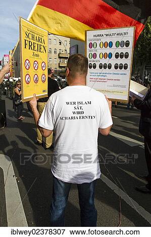 "Anti-Islam rally, protests, vigil of the right-wing populist """"Pro-Germany"""" party in Flughafenstrasse street, Berlin, Europe" View Large Photo Image Stock Photo - "Anti-Islam rally, protests, vigil of the right-wing populist """"Pro-Germany"""" party in Flughafenstrasse street, Berlin, Europe". Fotosearch