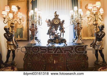 Stock Photo - "Antique dresser and furnishings adorn a hallway inside a Victorian mansion, Quebec Province, Canada, North America". Fotosearch