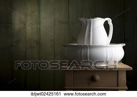 Antique porcelain basin on a small chest of drawers View Large Photo Image Stock Image - Antique porcelain basin on a small chest of drawers. Fotosearch