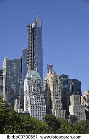 Stock Image - "Apartment buildings on Central Park South, Manhattan, New York City, New York, United States, North America". Fotosearch