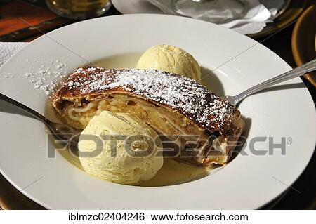 "Apple strudel served with vanilla ice cream on a white plate, Nuremberg, Middle Franconia, Bavaria, Germany, Europe" View Large Photo Image Stock Photograph - "Apple strudel served with vanilla ice cream on a white plate, Nuremberg, Middle Franconia, Bavaria, Germany, Europe". Fotosearch