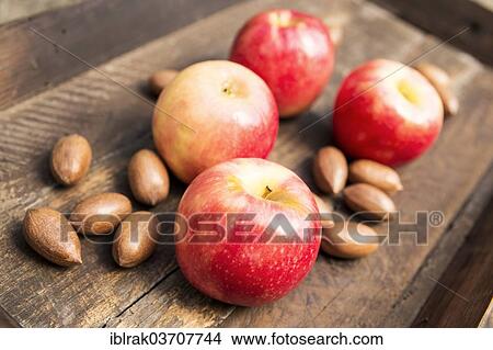 "Apples and pecan nuts in a wooden box, Germany, Europe" View Large Photo Image Picture - "Apples and pecan nuts in a wooden box, Germany, Europe". Fotosearch