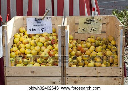 Stock Image - "Apples in wooden boxes at a market stall, Dortmund, Ruhr area, North Rhine-Westphalia, Germany, Europe, PublicGround, Europe". Fotosearch