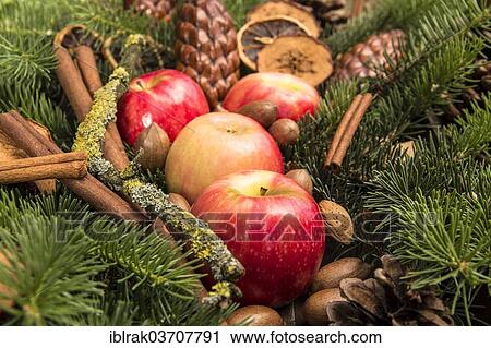 "Apples with pecan nuts, almonds and cinnamon sticks, pine branches, Germany, Europe" View Large Photo Image Stock Image - "Apples with pecan nuts, almonds and cinnamon sticks, pine branches, Germany, Europe". Fotosearch