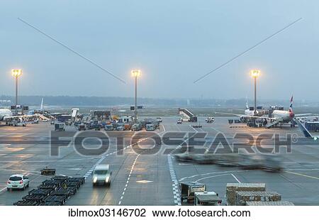 Stock Image - "Apron of Frankfurt Airport at dusk, Rhein-Main-Gebiet, Frankfurt am Main, Hesse, Germany, Europe". Fotosearch