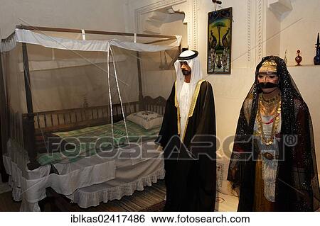 Arab couple wearing traditional clothing, life-size figures, Heritage House Museum, United Arab Emirates, Middle East, Asia View Large Photo Image Stock Photograph - Arab couple wearing traditional clothing, life-size figures, Heritage House Museum, United Arab Emirates, Middle East, Asia. Fotosearch