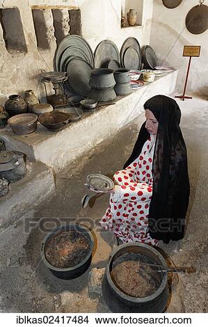 Picture - Arab woman, life-sized figure in a historical kitchen, Heritage House Museum, United Arab Emirates, Middle East, Asia. Fotosearch