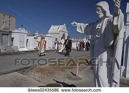 Stock Photograph - "Archbishop Gregory Aymond leads the Blessing of the Graves at St. Louis #3 Cemetery on All Saints Day, New Orleans, Louisiana, USA". Fotosearch