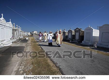 "Archbishop Gregory Aymond leads the Blessing of the Graves at St. Louis #3 Cemetery on All Saints Day, New Orleans, Louisiana, USA" View Large Photo Image Stock Photograph - "Archbishop Gregory Aymond leads the Blessing of the Graves at St. Louis #3 Cemetery on All Saints Day, New Orleans, Louisiana, USA". Fotosearch