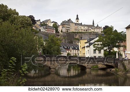 Stock Image - "Arched bridge made of stone across the Alzette river, Grund district, lower town, Luxembourg City, Luxembourg, Europe, PublicGround, Europe". Fotosearch