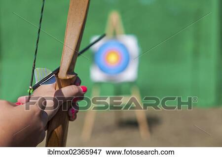 "Archer aiming bow and arrow at target, Hesse, Germany, Europe" View Large Photo Image Stock Photo - "Archer aiming bow and arrow at target, Hesse, Germany, Europe". Fotosearch