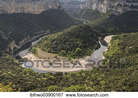 Stock Photo - "Ardeche Gorges, Gorges de l'Ardeche, view from the Balcon des Templiers lookout to the Cirque de la Madeleine river loop, Saint-Remeze, Rhone-Alpes, France, Europe". Fotosearch