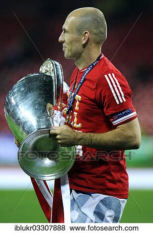 "Arjen Robben holding the trophy, UEFA Champions League Final 2013, Borussia Dortmund - FC Bayern Munich, Wembley-Stadium, London, London region, England, United Kingdom, Europe" View Large Photo Image Stock Photo - "Arjen Robben holding the trophy, UEFA Champions League Final 2013, Borussia Dortmund - FC Bayern Munich, Wembley-Stadium, London, London region, England, United Kingdom, Europe". Fotosearch