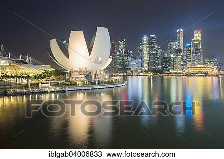 Stock Image - "Art and Science Museum and downtown central financial district at night, Singapore, Asia". Fotosearch
