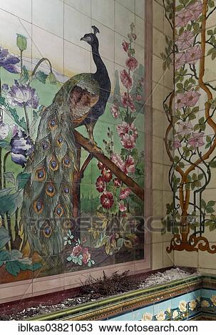 "Art Deco tile mural with a peacock and floral scrolls, Villa Olga, Blankenberge, West Flanders, Belgium, Europe" View Large Photo Image Stock Image - "Art Deco tile mural with a peacock and floral scrolls, Villa Olga, Blankenberge, West Flanders, Belgium, Europe". Fotosearch