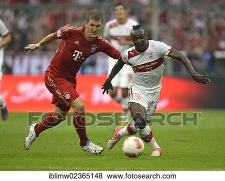 "Arthur Boka of VfB Stuttgart, right, in a duel with Bastian Schweinsteiger of FC Bayern Munich, left, Allianz Arena, Munich, Bavaria, Germany, Europe" View Large Photo Image Stock Photo - "Arthur Boka of VfB Stuttgart, right, in a duel with Bastian Schweinsteiger of FC Bayern Munich, left, Allianz Arena, Munich, Bavaria, Germany, Europe". Fotosearch