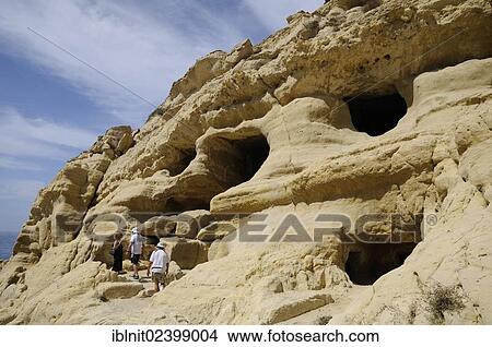 "Artificial caves in the cliff, beach of Matala, Crete, Greece, Europe" View Large Photo Image Picture - "Artificial caves in the cliff, beach of Matala, Crete, Greece, Europe". Fotosearch