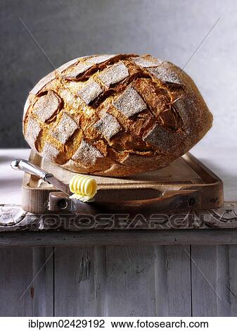 Stock Image - Artisan organic wholemeal bread loaf. Fotosearch
