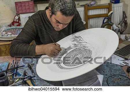 Picture - "Artisan painting a large ceramic bowl, Omurlu ceramic, Avanos, Cappadocia, Nevsehir Province, Turkey, Asia". Fotosearch