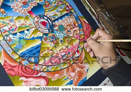Stock Photo - "Artist painting a colorful Thangka in one of the art schools near Boudnath Stupa, Kathmandu Valley, Kathmandu, Kathmandu District, Bagmati Zone, Nepal, Asia". Fotosearch