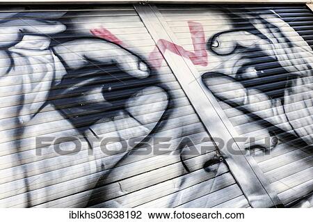 Stock Image - "Artistic graffiti on a shutter, Berlin, Berlin, Germany, Europe". Fotosearch