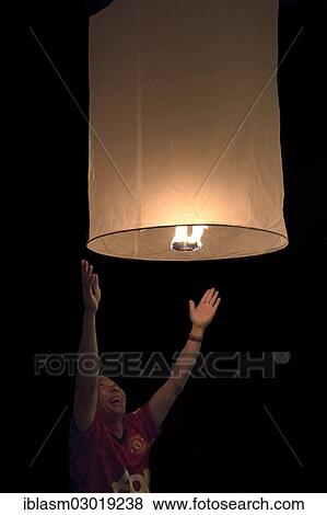 "Ascending hot air balloon at the Loi Krathong Festival of Light, Chiang Mai, Chiang Mai, Northern Thailand, Thailand, Asia" View Large Photo Image Stock Photo - "Ascending hot air balloon at the Loi Krathong Festival of Light, Chiang Mai, Chiang Mai, Northern Thailand, Thailand, Asia". Fotosearch