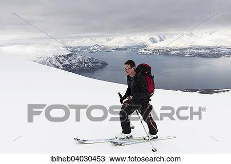 Stock Image - "Ascent on skis to the Giilivarri, below the Lyngenfjord, Lyngsalpene, Lyngen, Troms, Norway, Europe". Fotosearch