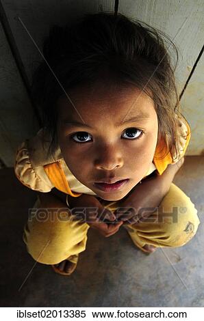 "Asian girl looking up, Cambodia, Southeast Asia, Asia" View Large Photo Image Stock Photography - "Asian girl looking up, Cambodia, Southeast Asia, Asia". Fotosearch