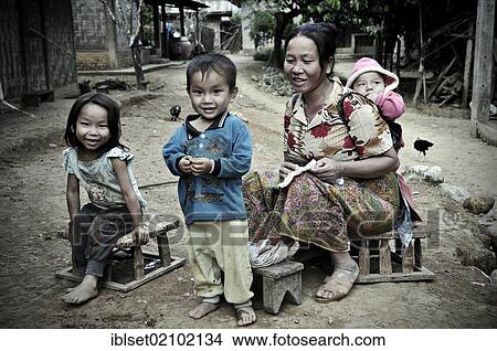 Picture - "Asian mother and children in a mountain village, Laos, Southeast Asia, Asia". Fotosearch