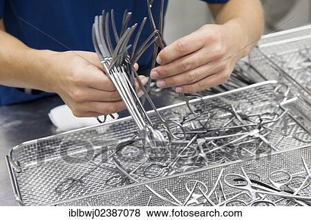 "Assembly of instrument sets, Zentrale Sterilgutversorgungsabteilung, Central Sterile Supply Department, Hospital of Munich University, Grosshadern Campus, Munich, Bavaria, Germany, Europe" View Large Photo Image Stock Photo - "Assembly of instrument sets, Zentrale Sterilgutversorgungsabteilung, Central Sterile Supply Department, Hospital of Munich University, Grosshadern Campus, Munich, Bavaria, Germany, Europe". Fotosearch