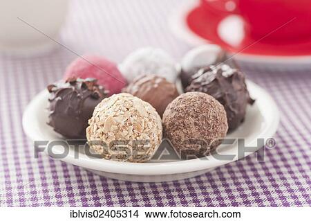 Assorted chocolate truffles on a plate View Large Photo Image Picture - Assorted chocolate truffles on a plate. Fotosearch